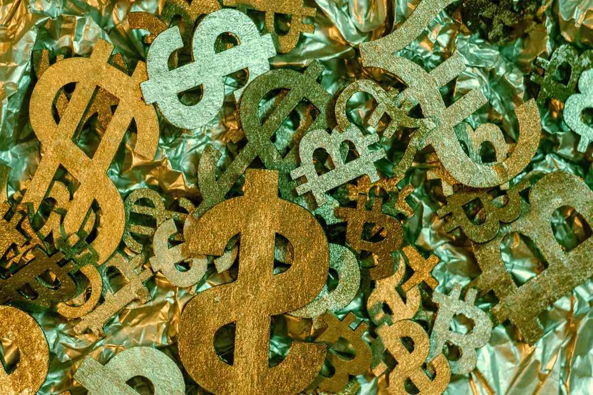 A pile of dollar signs represents agile and dynamic pricing.